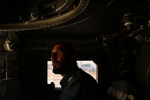 Uruzgan Police Chief, Matiullah Khan, inside his armoured humvee about to exit his compound in Tarin Kowt, Uruzgan, Afghanistan.
