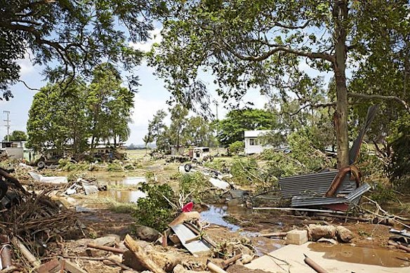 Emergency services search for bodies in the town of Grantham, in the Lockyer Valley, which was devastated by a sudden flood on January 10. Photo: Dean Saffron