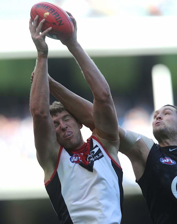 Jake Spencer outmarks Robert Warnock.