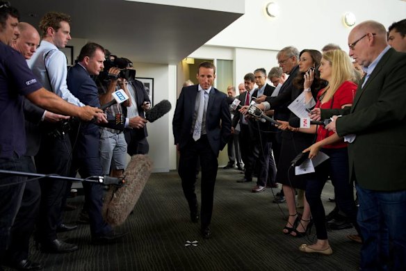 Jockey Damien Oliver talks to the media after being given a 10 month ban at the betting inquiry at Racing Victoria.