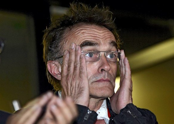 The director of the opening ceremony, Danny Boyle, reacts during the ceremony.