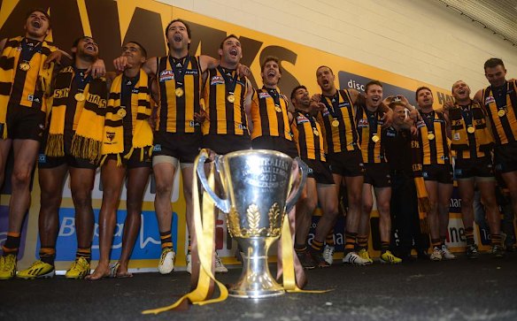 Hawthorn celebrates winning the 2013 AFL Premiership Cup.
