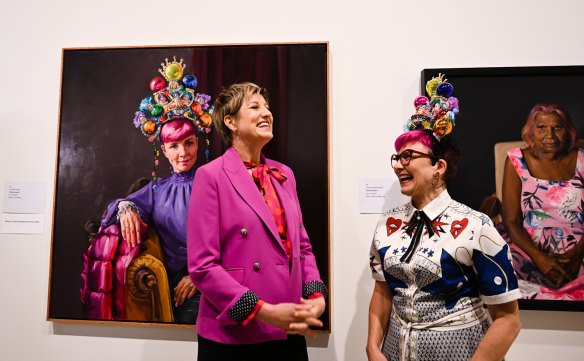 Winner of the Archibald Packing Room Prize Andrea Huelin with her sitter Cal Wilson in the Art Gallery of NSW on Thursday.