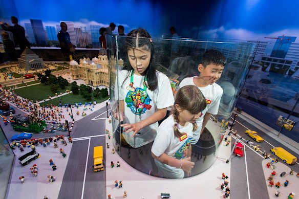  (L-R) Caitlin, 11, Chloe, 8 and Owen, 10 enjoy a lego view of Melbourne at the opening of the LEGOLAND Discovery Centre at Chadstone Shopping Centre.