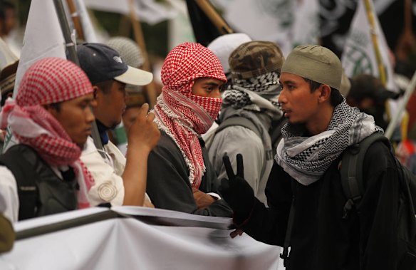 Hundreds of protestors gathered for anti US protests at the Bunderan Hotel Indonesia traffic circle in Central Jakarta, Indonesia.