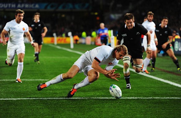 Aurelien Rougerie of France safely grounds the ball.