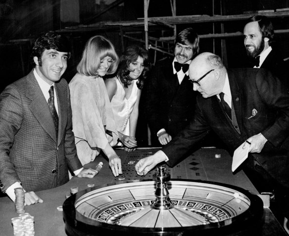 John Haddad, General manager of Federal Pacific Hotels (left), watches a croupier training session at Wrest Point Casino on November 21, 1972.