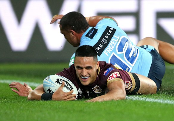Valentine Holmes of the Maroons scores the first try.