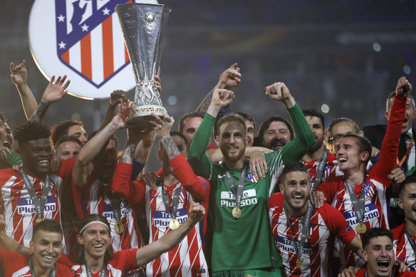 Team spirit: Atletico Madrid celebrate their Europa League final victory.