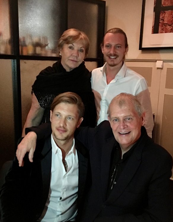 John Farnham with wife Jill and sons Rob (front) and James in 2018.