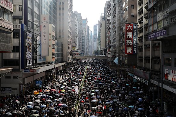 Demonstrators march along Hennessy Road during a protest in the Causeway Bay district of Hong Kong, China, on Sunday, Sept. 15, 2019.