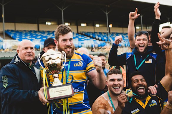 Woden Valley Rams captain Jeffrey Morgan celebrates their win.

