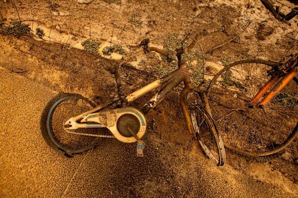  Young Theo and his family rode their bike to Bastion Point beach and dug a hole  in the sand where they hid over night while the fire came through. The remains of his bike after the fire.
