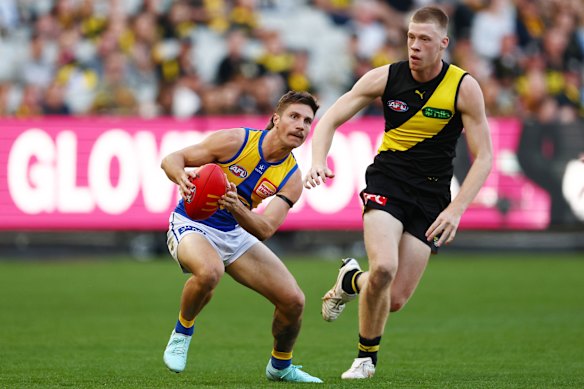 New boy: Eagles recruit Liam Baker, who won two premierships in his time with the Tigers, takes possession against his former team.