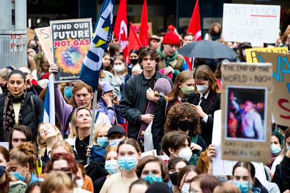 Students close the streets in central Sydney in a mass protest against government inaction against climate change.