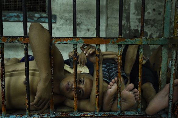 Prisoners inside an overcrowded cell in Manila Police Headquarters. 