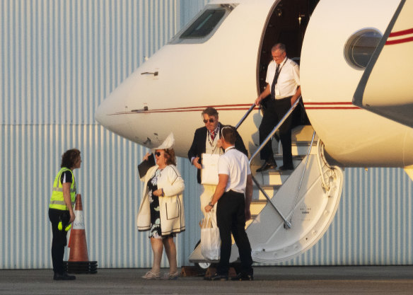 Gina Rinehart disembarks her private jet in Sydney after touching down in all her racewear finery with her entourage in tow.