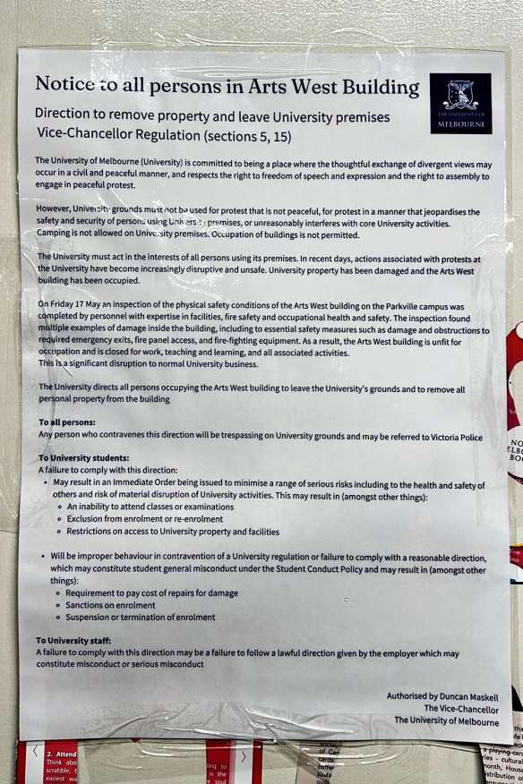 The University of Melbourne’s notice ordering protesters to leave the premises, which was taped to wall at the Arts West building.