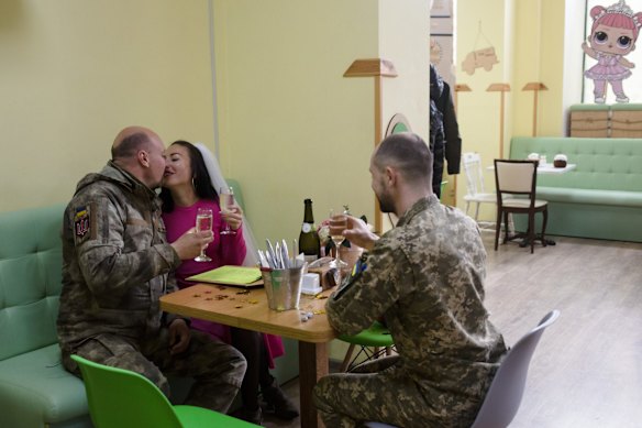 Svitlana and Andriy, a Ukrainian serviceman, celebrate their wedding in one of the few open cafes in Mykolaiv, Ukraine. The couple dated for a few years and planned a wedding in Kyiv, where they are both from, but had to change plans due to the war. 
