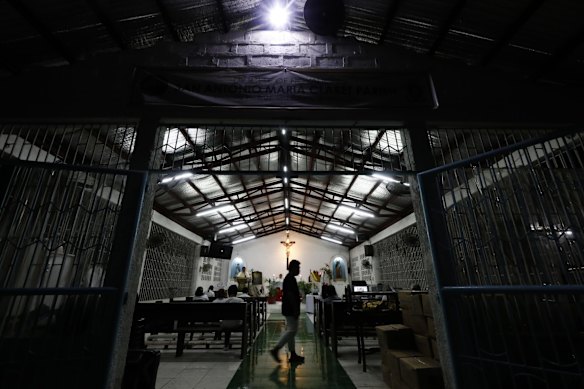 A Catholic mass is held during early morning hours and streamed online to mark Easter Sunday at a church in Quezon City, Metro Manila, Philippines.