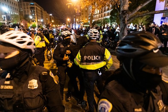 Demonstrators and police officers clash during the 2020 Presidential election in Washington, D.C., U.S.