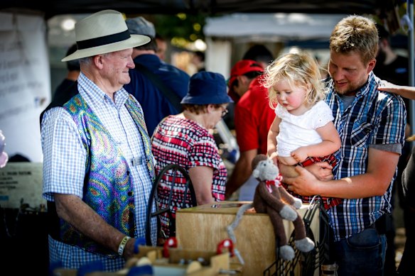 The Lost Trades Fair at Kyneton Racecourse. Adam Damen with his daughter Eleanor checks out Graeme McDiarmid's mechanical organs.
