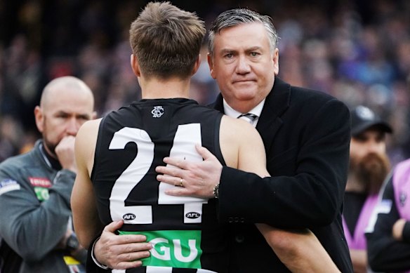 Collingwood president Eddie McGuire hugs Josh Thomas of the Magpies after their loss during the 2018 AFL Grand Final match between the Collingwood Magpies and the West Coast Eagles at Melbourne Cricket Ground on September 29, 2018 in Melbourne, Australia.