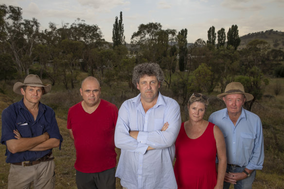 Tharwa residents, from left, Myles Gostelow, Karim Haddad, Kevin Jeffery, Janet Flint and Michael Lonergan stand near the site of a proposed firefighting water supply on the Murrumbidgee River.