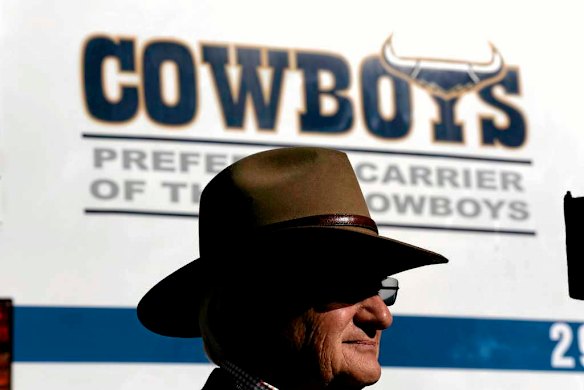 Liberal MP Philip Ruddock listens as Opposition Leader Tony Abbott addresses the media.