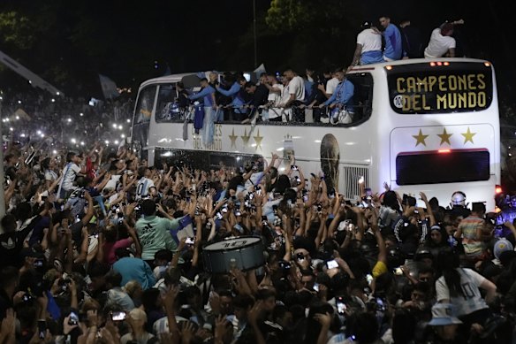 Fans welcome home the players from the Argentine soccer team that won the World Cup after they landed at Ezeiza airport in Buenos Aires, Argentina.