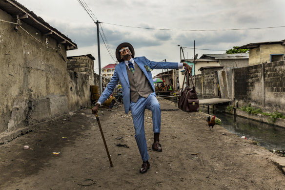 Elie, 45, struts his stuff in the streets of Brazzaville. He has been a sapeur for 35 years and his elaborate outfits bring joy to himself and his community.