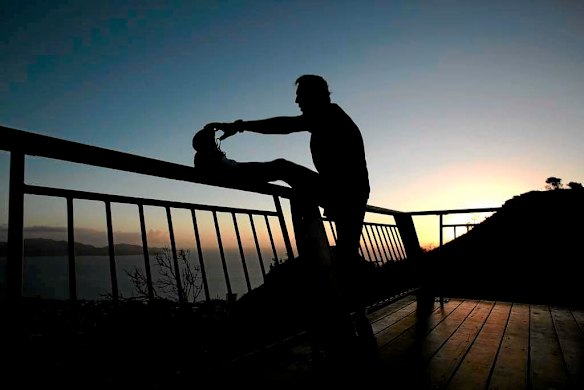 Opposition Leader Tony Abbott prepares for a dawn run.