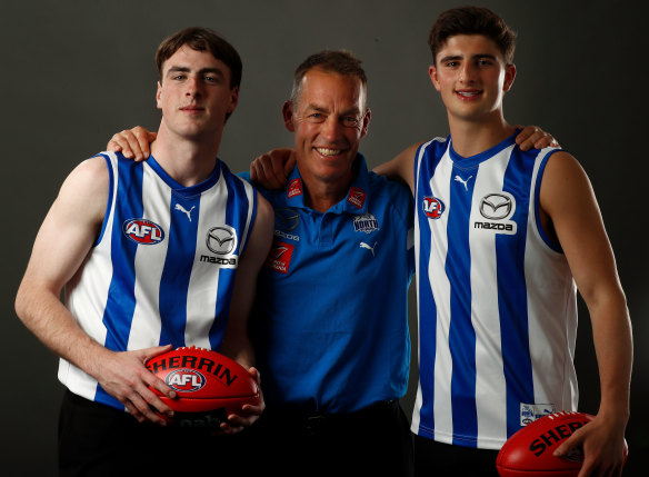 Roos on the rise: North Melbourne draftees George Wardlaw and Harry Sheezel with coach Alastair Clarkson.