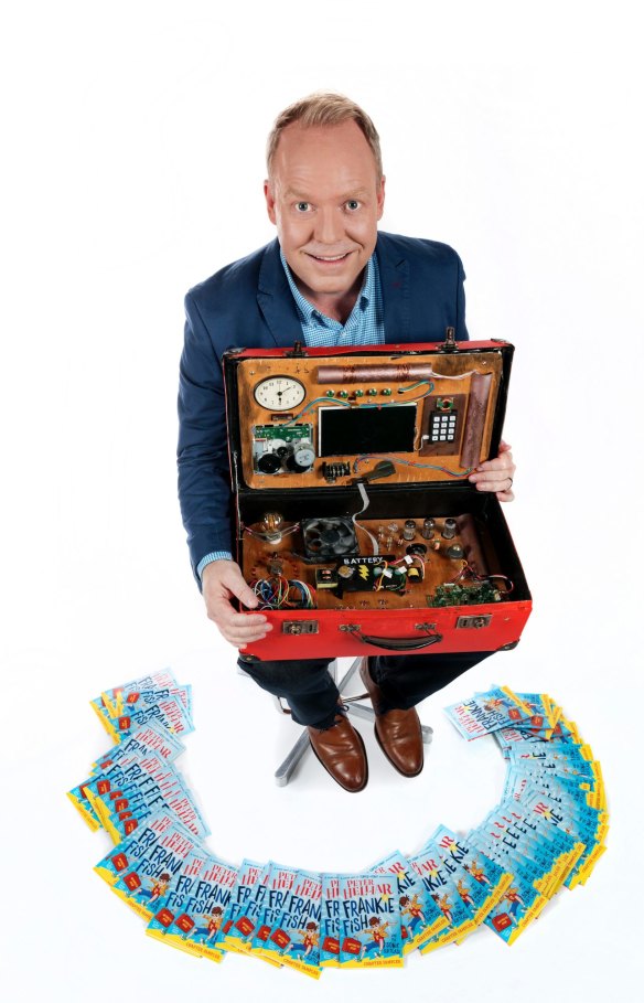 Peter Hellier with his first children's book, Frankie Fish and the Sonic Suitcase