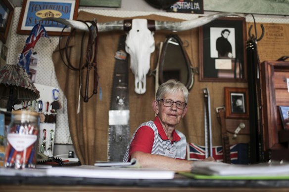 Elaine Maguire, volunteer with the Tenterfield Saddler, among a collection of Australian memorabilia at the shop. Tenterfield, NSW, has seen a decline in tourism following the drought and recent bushfires.