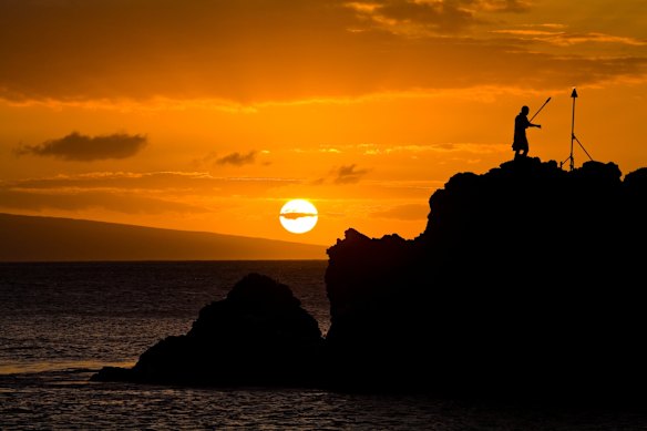 Torch-lighting ceremony at Black Rock, Maui, Hawaii. 