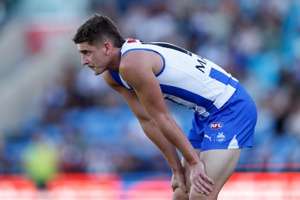Deep breath: North Melbourne debutant Riley Hardeman assesses the situation.
