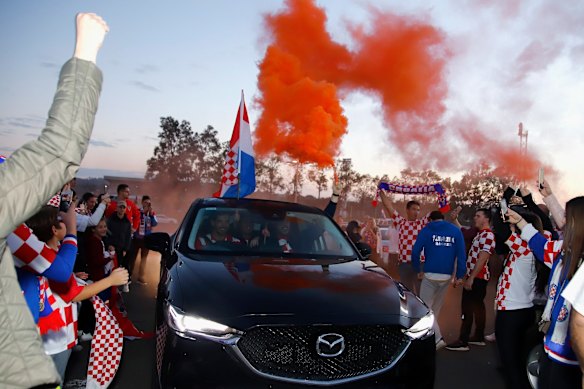 Fans celebrate after the FIFA World Cup semi-final between Croatia and England at King Tom Club in Sydney.