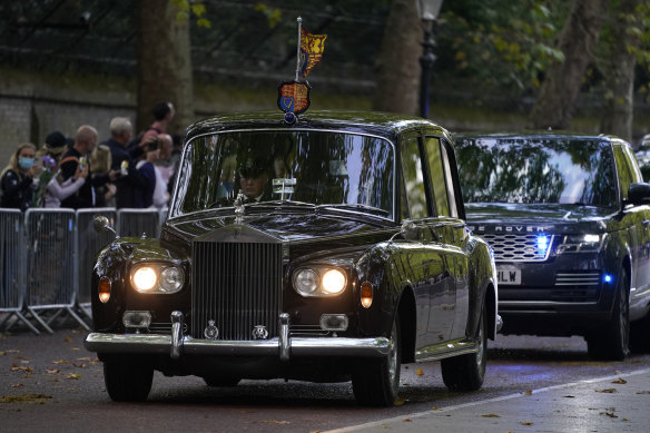 The car carrying King Charles III and Camilla, the Queen Consort, heads to Buckingham Palace in London.