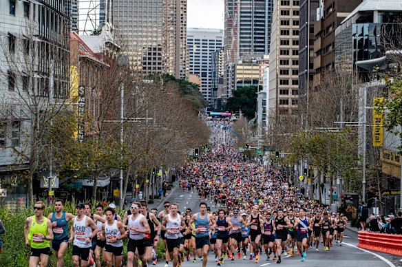 Runners head down Williams Street at the start of the City2Surf.