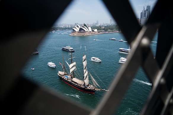Australia Day Tall Ships race towards the Harbour Bridge in Sydney.