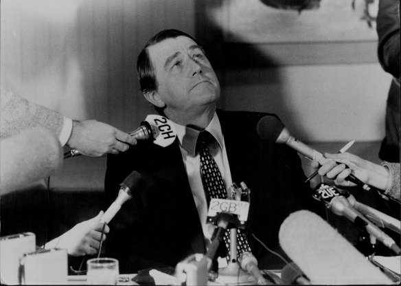Firmly back in the chair... Premier Neville Wran at a press conference to announce the findings of the Royal Commission on July 28, 1983.