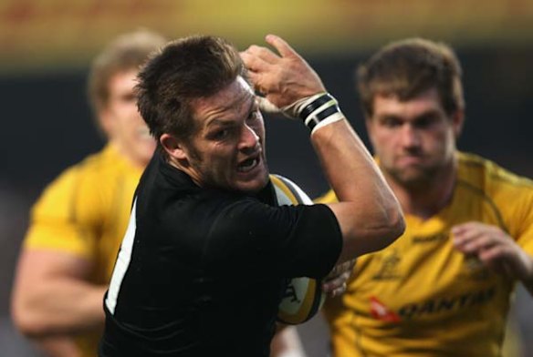 Richie McCaw makes a break.