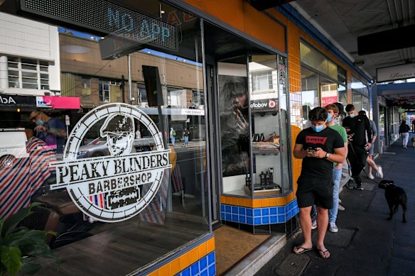 Customers line up at the Peaky Blinders Barbershop in St Kilda.