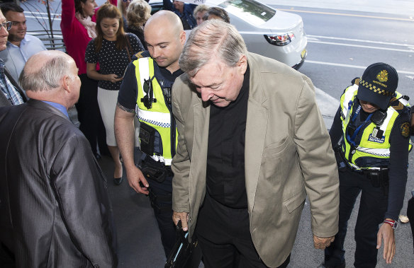 Cardinal George Pell arrives at court on Wednesday.