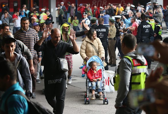 Migrants arrive on a train from Hungary at Munich Hauptbahnhof main railway station in Munich, Germany. 