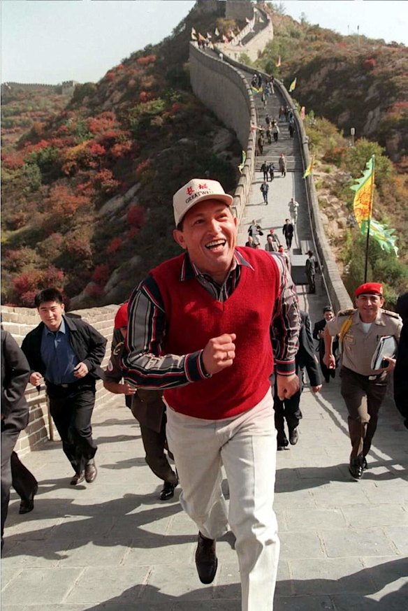 In this Oct. 11, 1999 file photo, Venezuela's President Hugo Chavez wears a Great Wall cap as he runs on a section of the Great Wall of China, north of Beijing.