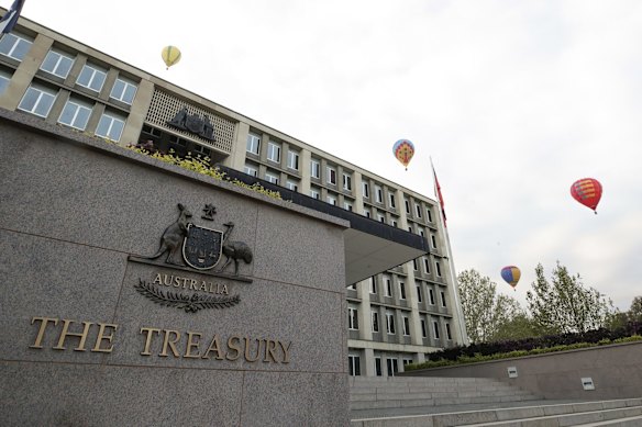 Balloons going past the Treasury building during the Canberra Balloon Spectacular festival.