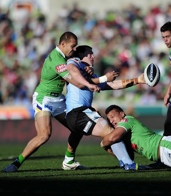 Blake Ferguson and Josh Papalii can't stop Paul Gallen from offloading.