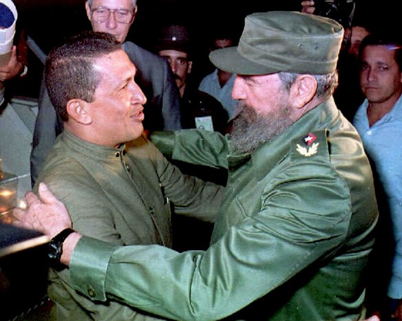This file picture shows retired Venezuelan military officer Hugo Chavez (L) meeting with Cuban President Fidel Castro (R) upon his arrival at Jose Marti Airport in Havana 13 December, 1994.